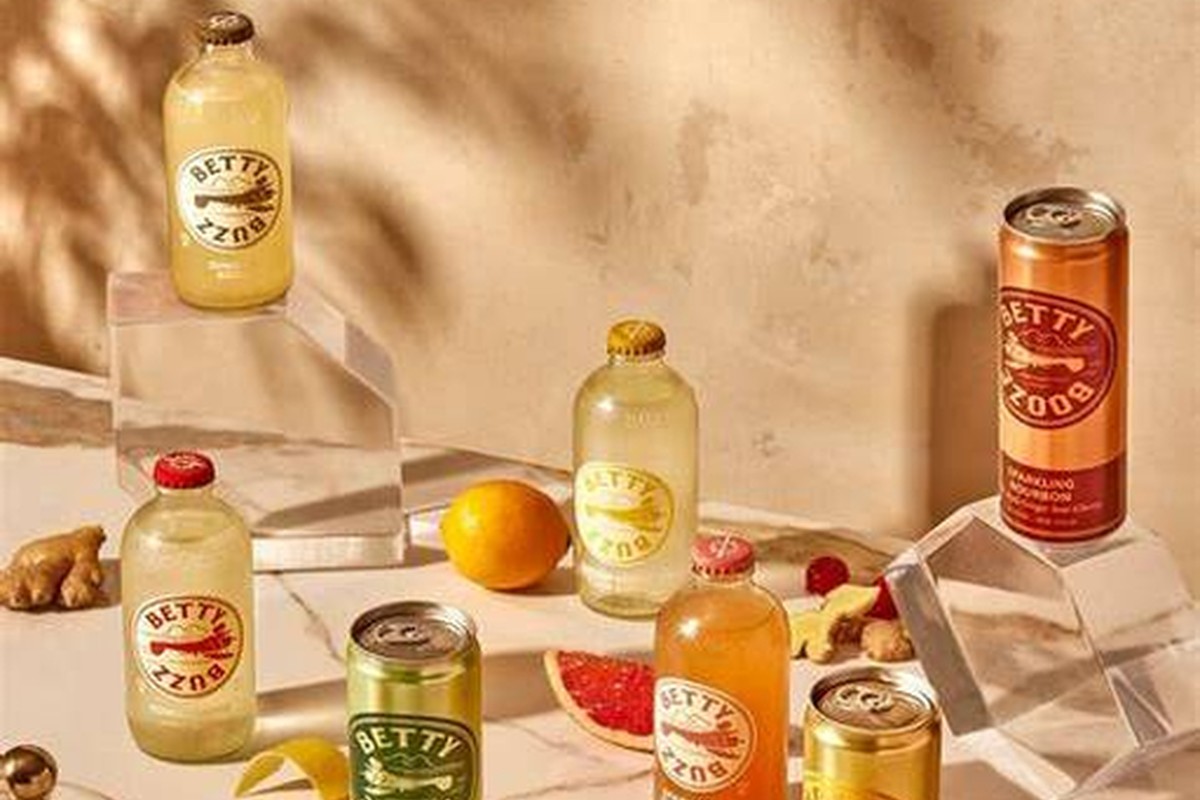 Beverage bottles arranged with fruit for food and drink e-commerce imagery